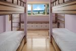 Main floor bedroom with 4 twin custom bunks.  Ideal for families.